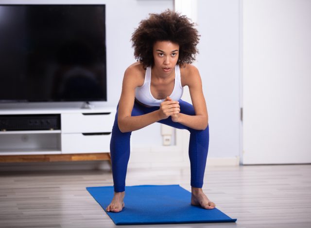 woman doing bodyweight squats