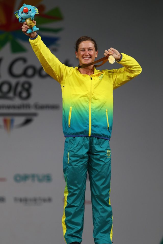Tia-Clair Toomey holds up medal