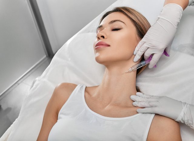 woman getting botox injection in neck