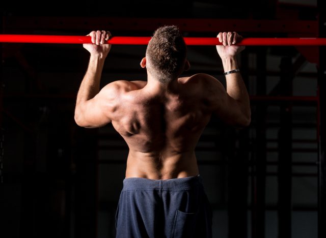 fit man doing chin-ups exercise