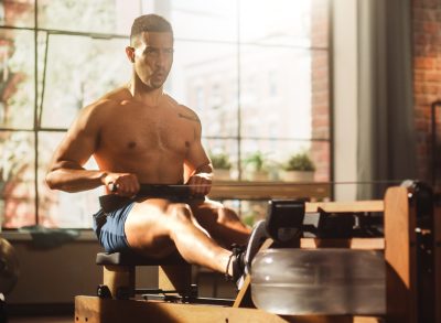 fit man doing rowing workout, concept of exercises for better joint health