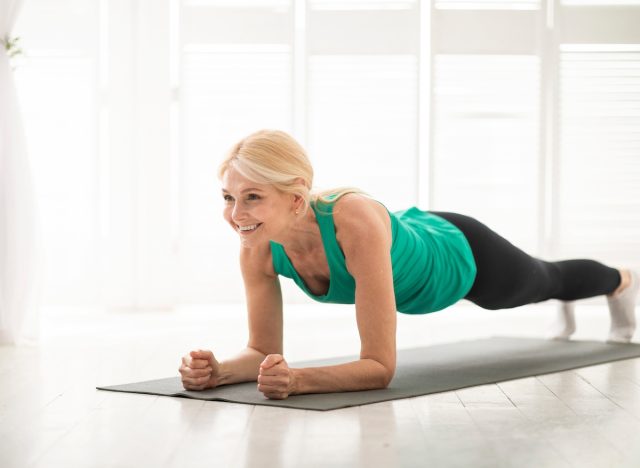 mature woman doing planks, concept of age-defying workout for women in their 50s