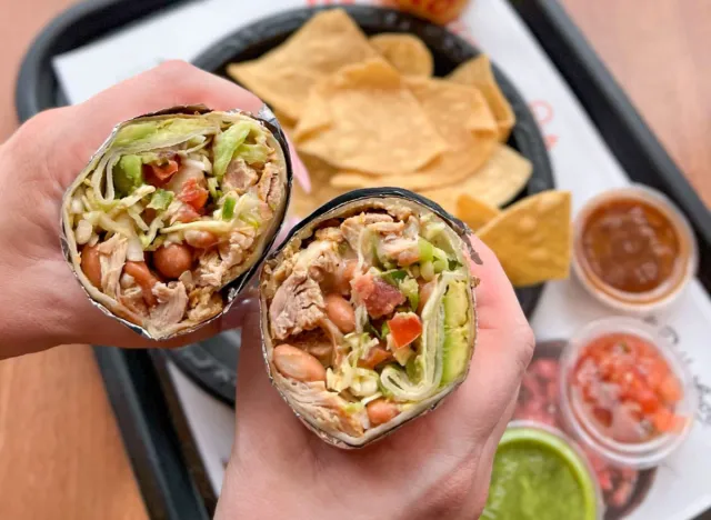 person holding el pollo loco burrito