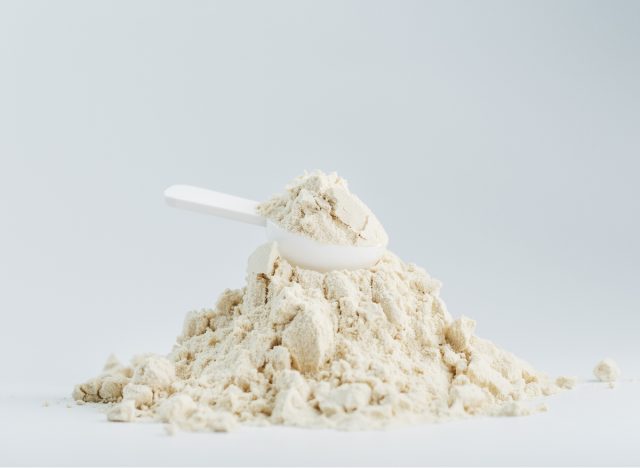 pile of protein powder and scoop