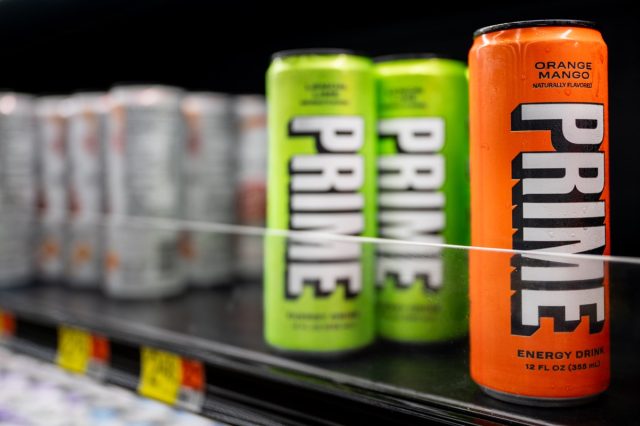 PRIME energy drinks are displayed for sale on shelves at a Walmart Supercenter