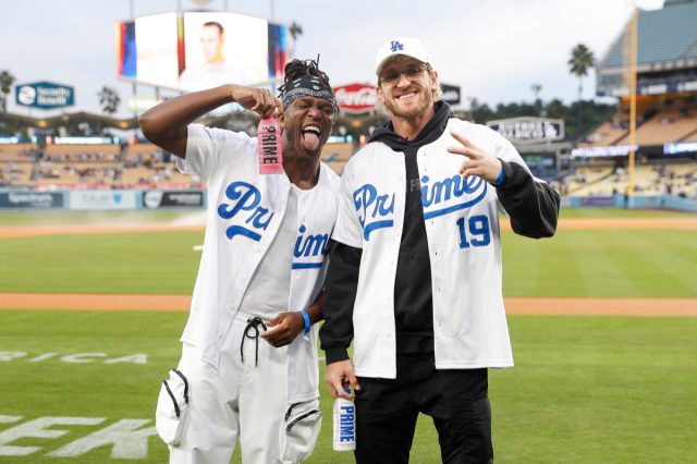 Logan Paul and KSI pose with Prime hydration bottles.