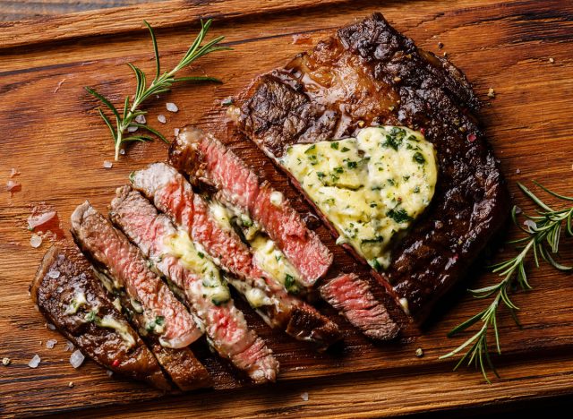 herbed flavored compound butter on steak
