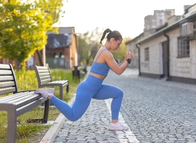 fitness woman demonstrating bulgarian split squat exercises to tighten butt cellulite