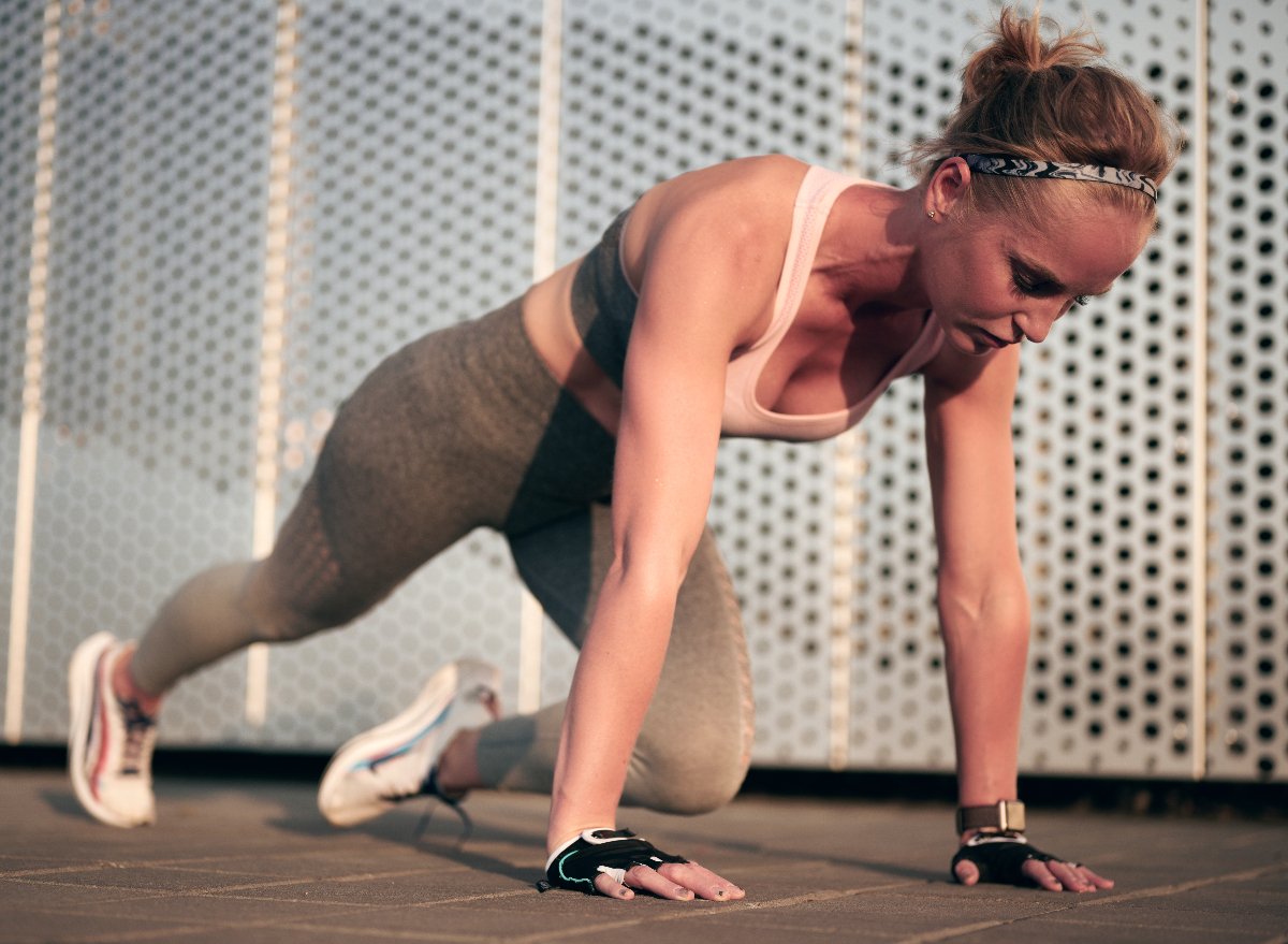 woman doing mountain climber ab exercise, concept of exercises for a slim waist