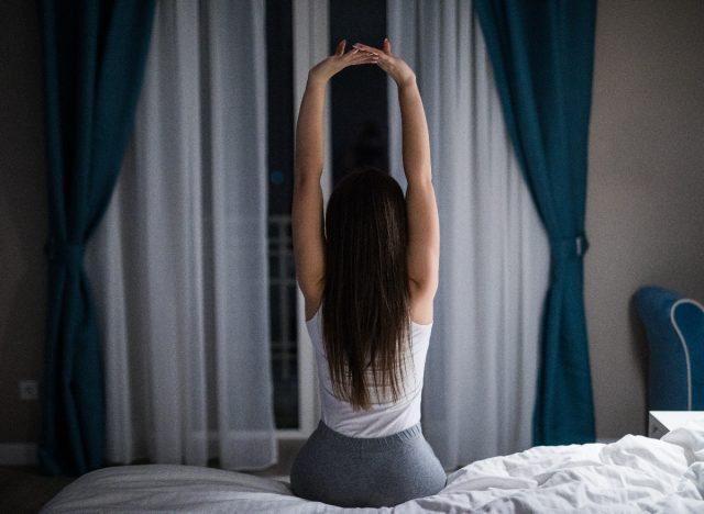 woman stretching before bed