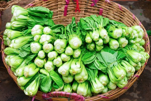 Green chinese cabbage at the counter in the street market in Can Tho, Vietnam