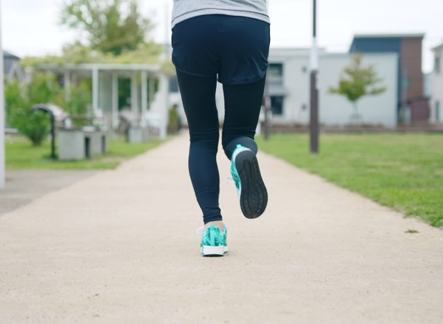 close-up runner's legs and sneakers