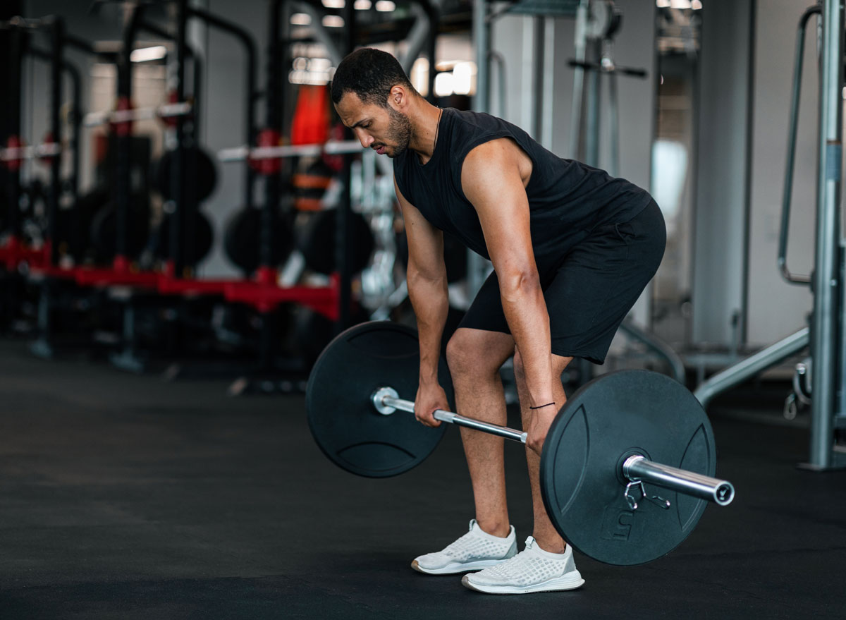 middle aged man exercising with deadlifts