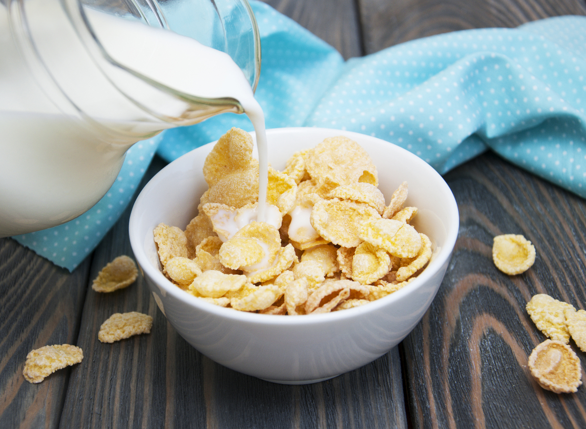 Breakfast Crunchy Cereal Poured in Bowl with Milk or Yogurt in