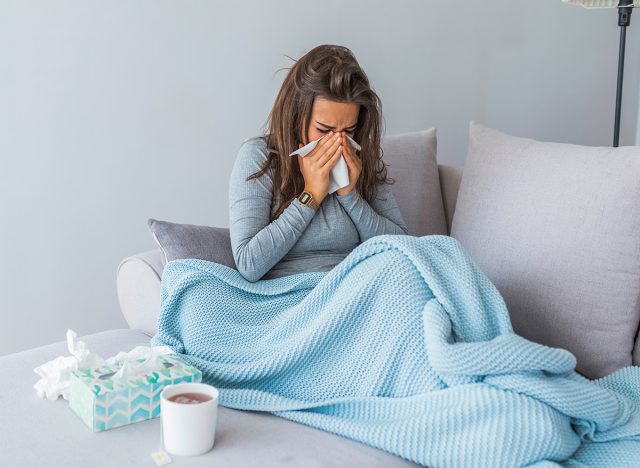 woman sick with tissue