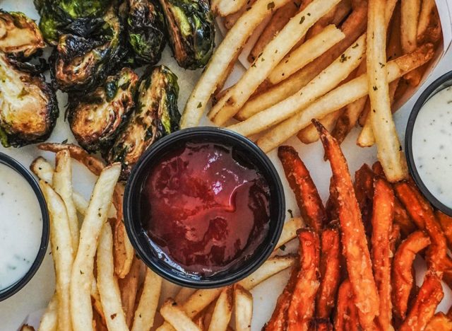 smashburger crispy brussels sprouts, regular fries, and sweet potato fries