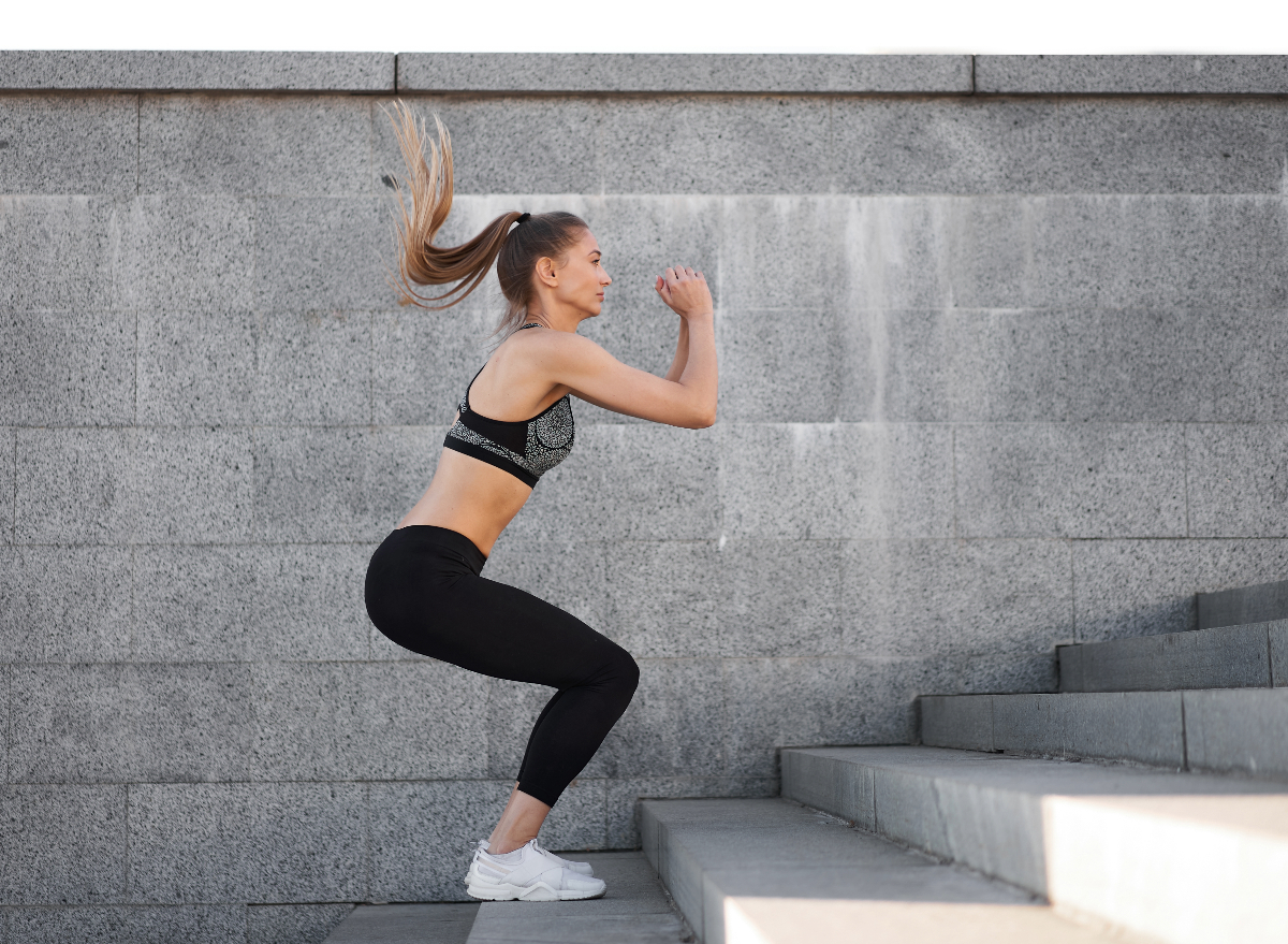 woman doing jump squats, concept of workout for women to lose weight