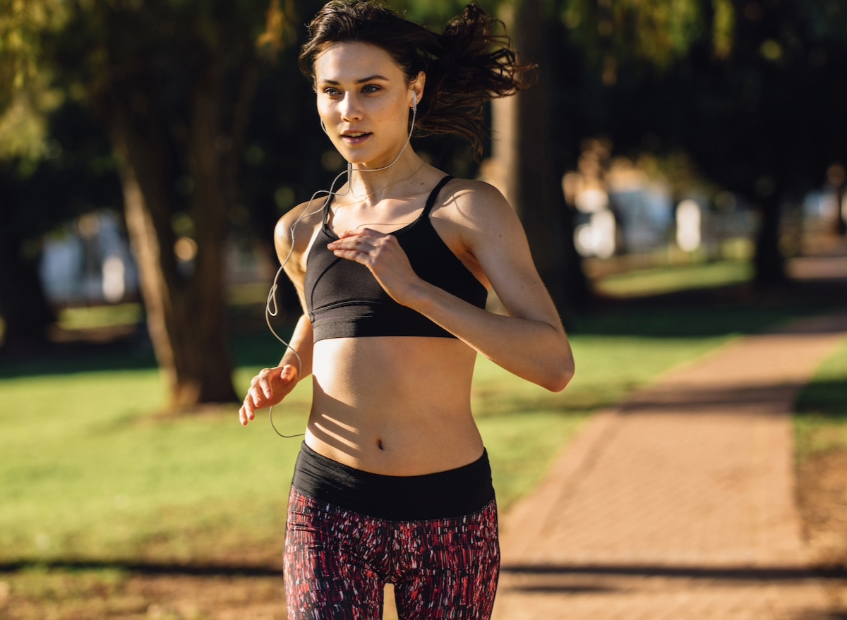 woman running outdoors, concept of common exercises you're doing wrong