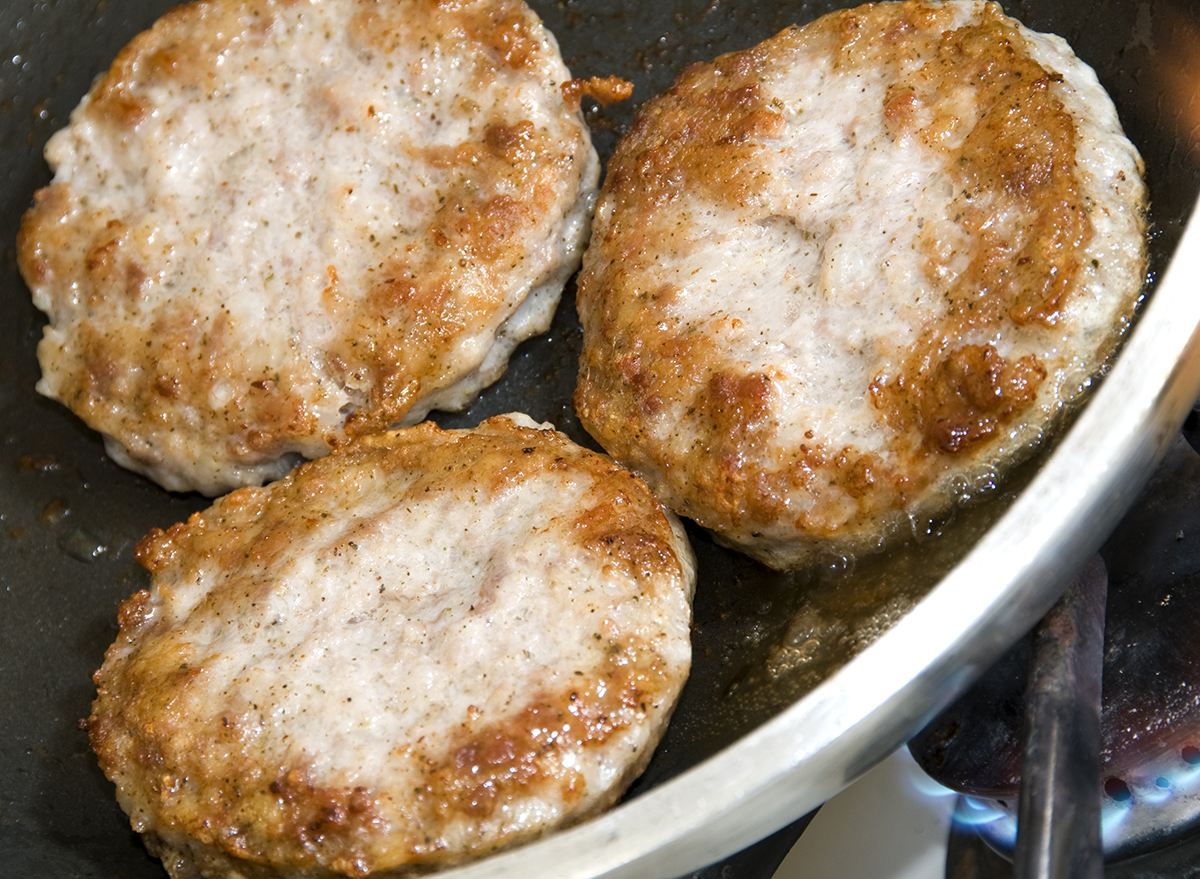 Breakfast sausage cooking in a pan