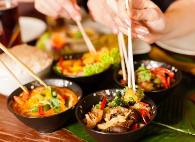 Young people eating in a Thai restaurant