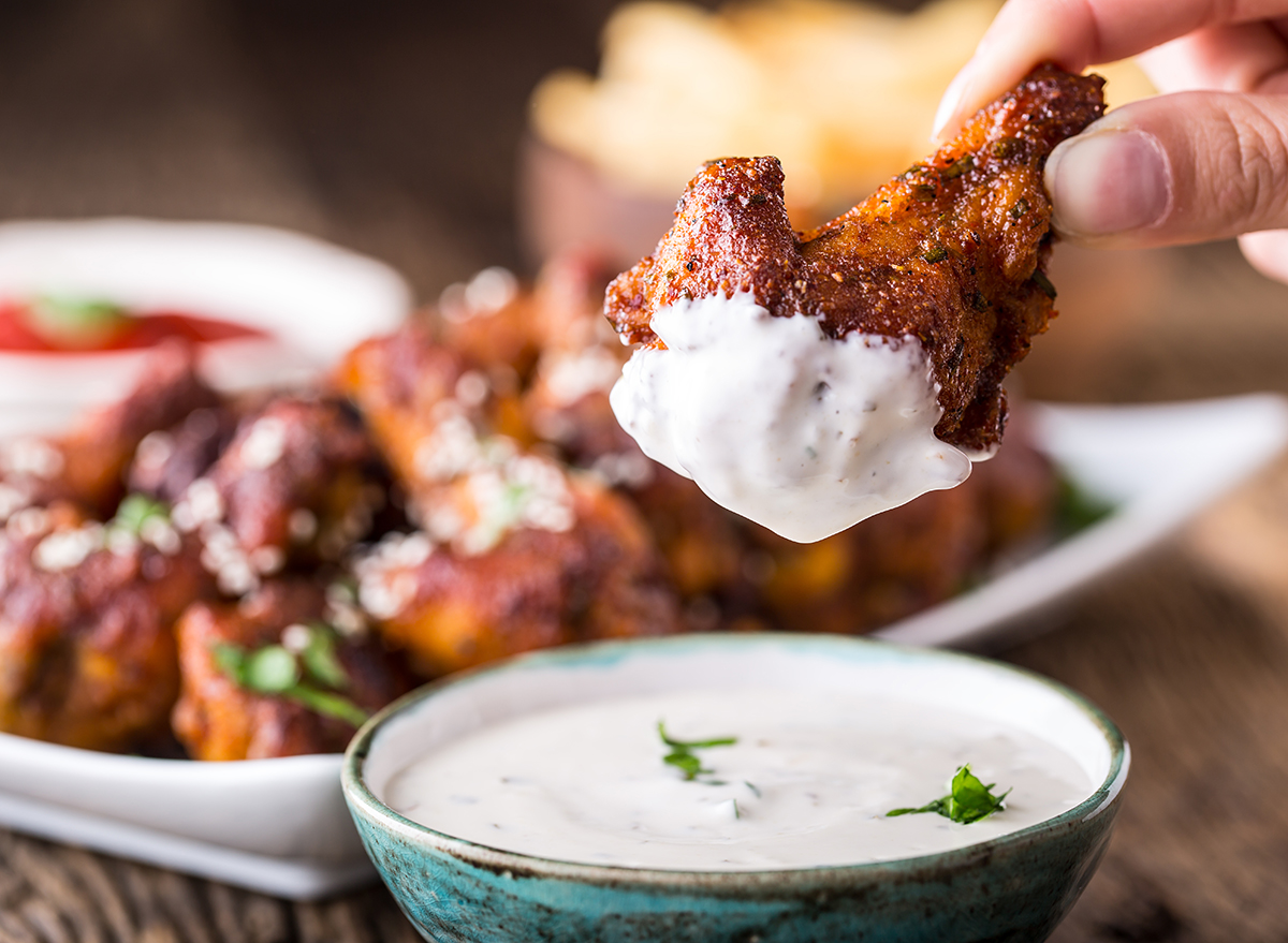 Fried chicken wings on slate board