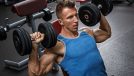 man dumbbell shoulder press, concept of daily workout to prevent muscle loss