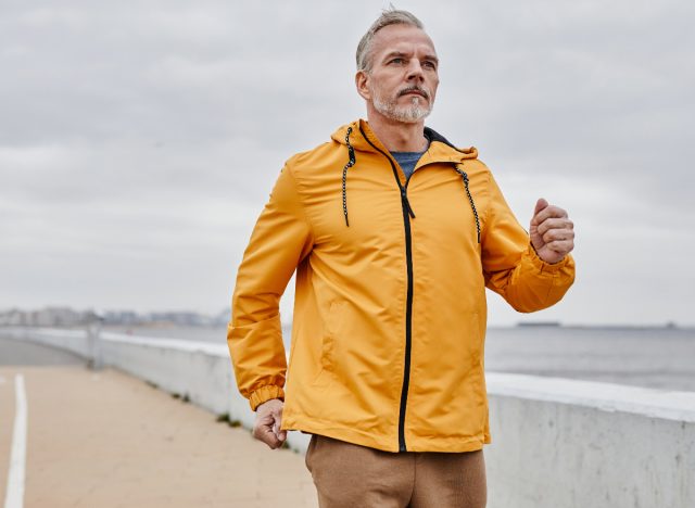 mature man walking outdoors, concept of fitness tips to prevent bone loss