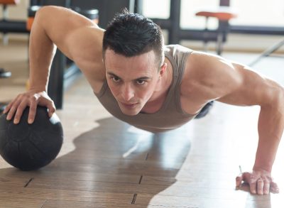 medicine ball pushup, floor exercises for a ripped chest