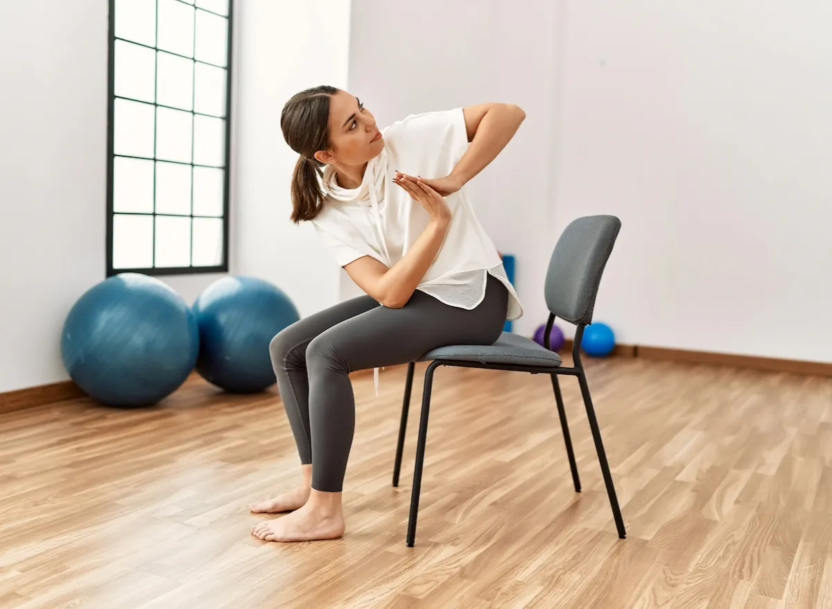 woman doing chair yoga exercises