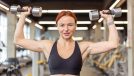 woman dumbbell press, concept of workout to lose belly fat and arm fat