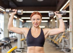 woman dumbbell press, concept of workout to lose belly fat and arm fat