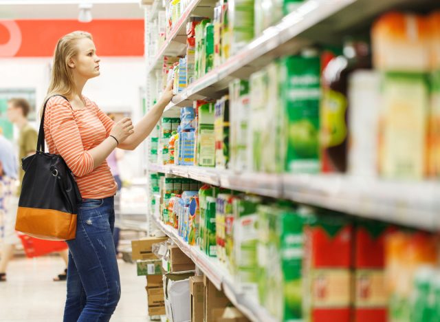 woman looking at grocery shelf