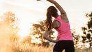 woman outdoors morning stretching, concept of morning habits for all-day energy