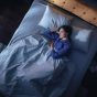 woman sleeping in bed, concept of cricketing