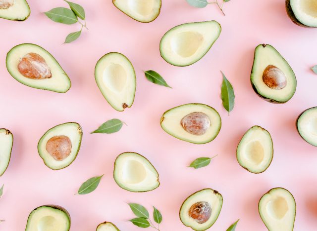 avocados on pink backdrop, concept of anxiety superfoods