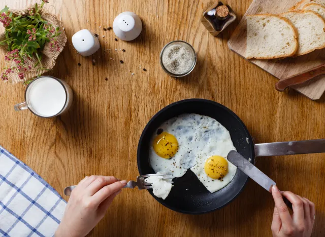 eating sunny-side-up eggs