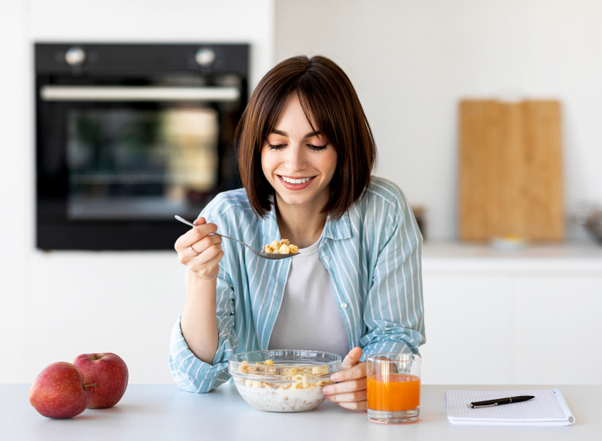 woman eating healthy breakfast, concept of healthy habits challenge to transform body