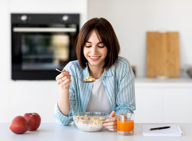 woman eating healthy breakfast, concept of healthy habits challenge to transform body
