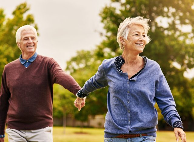 happy mature couple outdoors on a walk