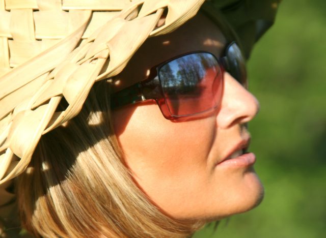 woman in sunshine wearing sunglasses