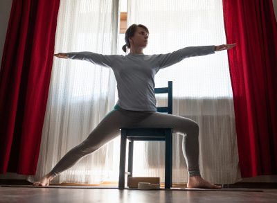 Warrior II, concept of chair yoga exercises for weight loss