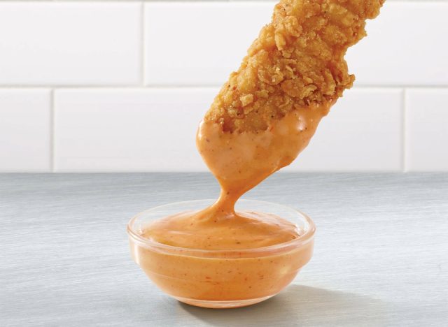 wendy's chicken tender dipping into s'awesome sauce