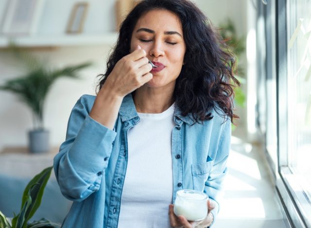 woman eating Greek yogurt