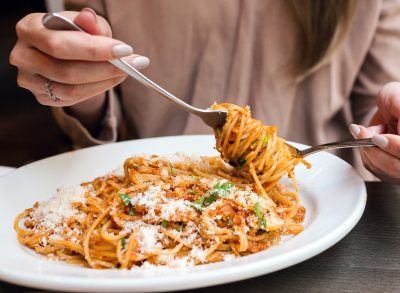 woman eating pasta