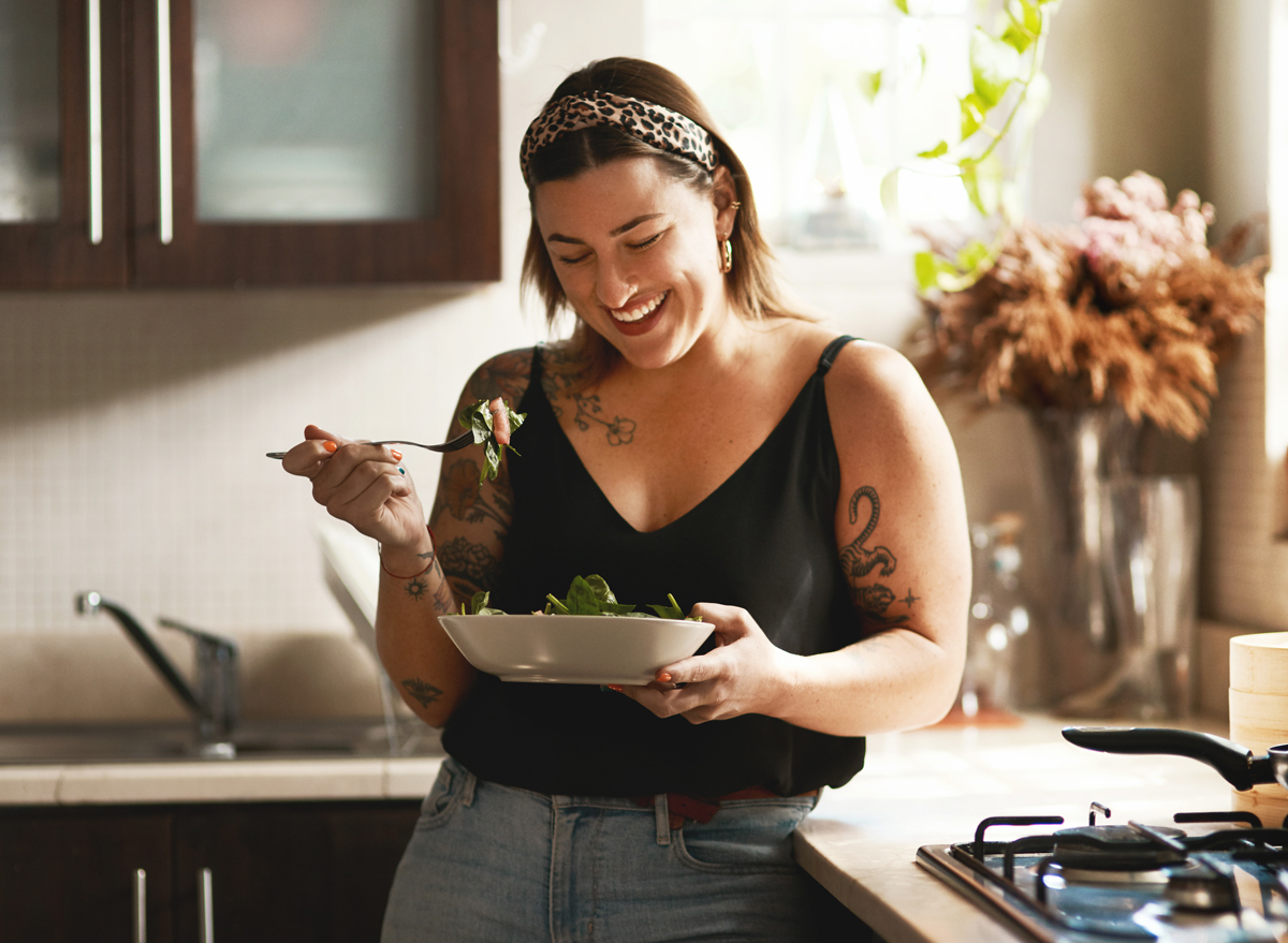 woman eating a salad on a diet