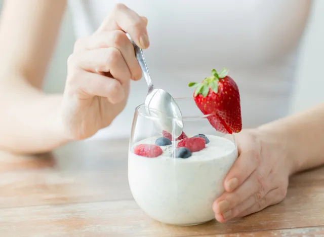 woman eating yogurt, concept of can eating yogurt help you lose weight