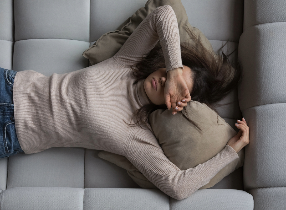 woman feeling tired and sluggish, concept of habits that drain energy