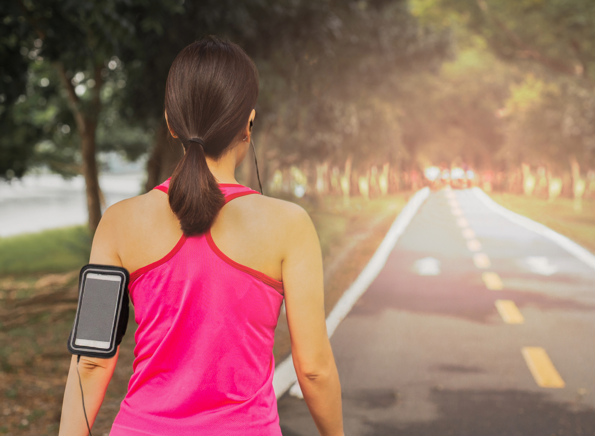 woman walking outdoors, concept of daily walking workout to slim down