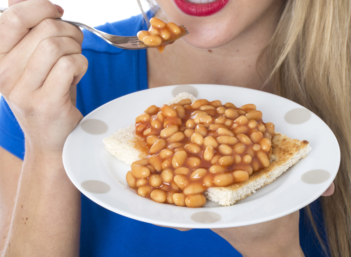 can eating beans help you lose weight concept, woman eating beans