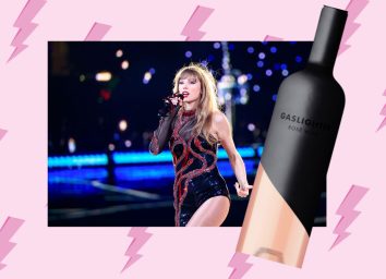 taylor swift performing at her eras tour on a pink background with lighting bolts and a bottle of gaslighter rose wine